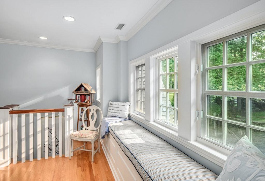 123 Long Neck Point Road Darien, CT 06820 - Photo 26 of 41 a living room with furniture and a window