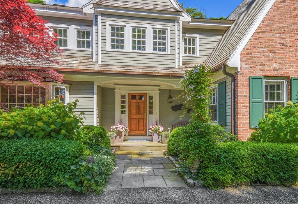 123 Long Neck Point Road Darien, CT 06820 - Photo 5 of 41 front view of a house with a yard