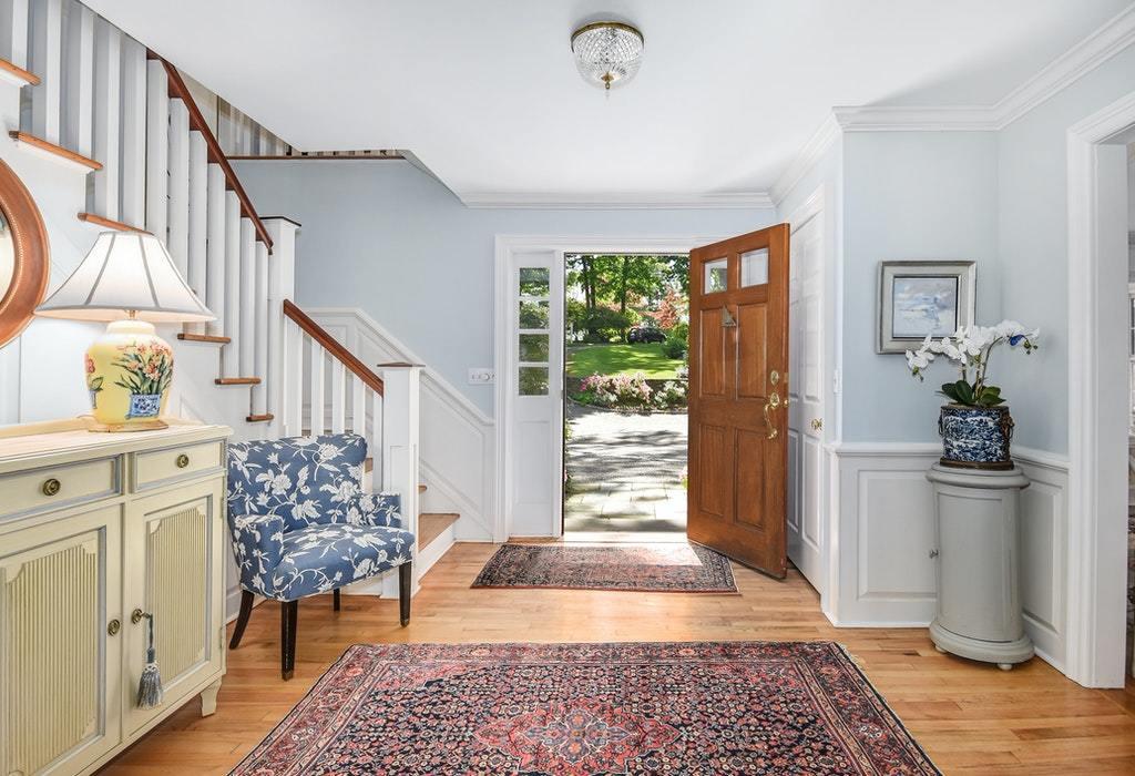 123 Long Neck Point Road Darien, CT 06820 - Photo 6 of 41 a view of entryway with wooden floor and a rug