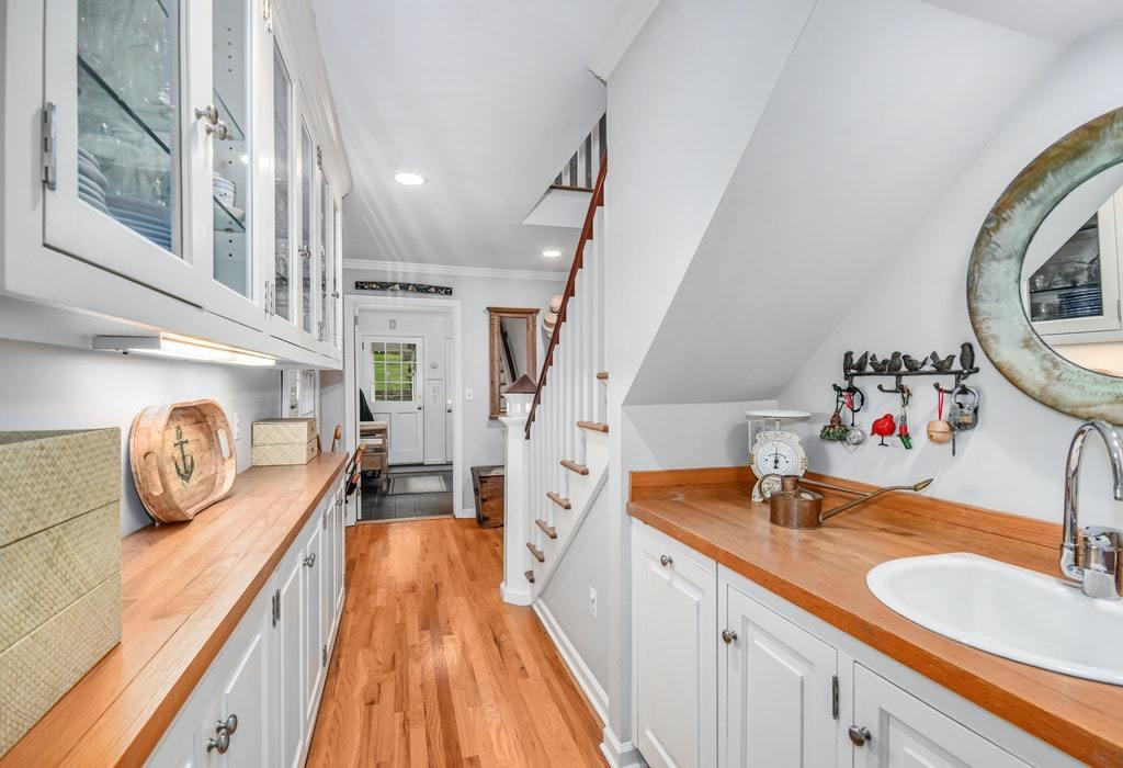 123 Long Neck Point Road Darien, CT 06820 - Photo 9 of 41 a bathroom with a sink and a mirror