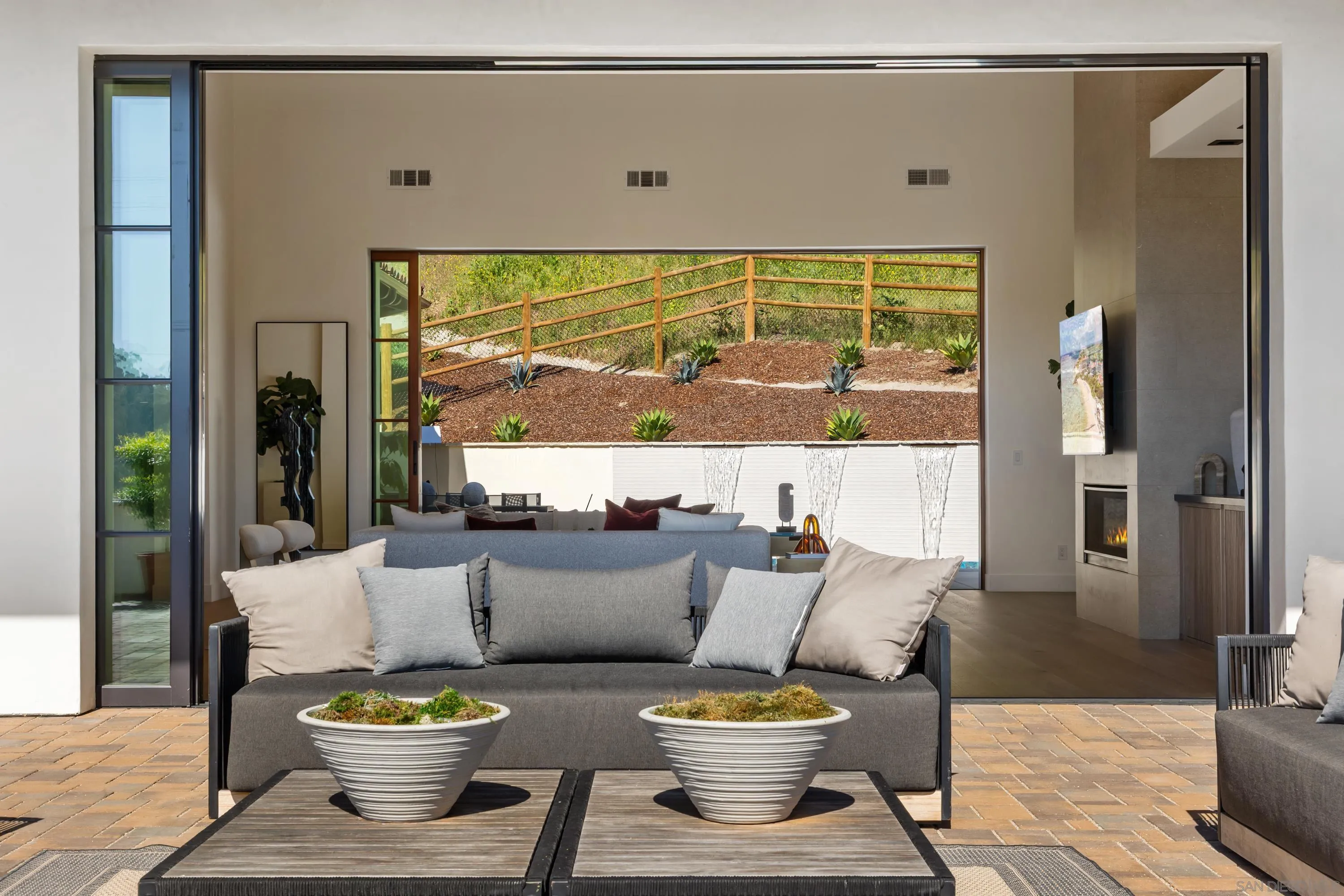 5758-60 Las Palomas Rancho Santa Fe, CA 92067 - Photo 18 of 64 a living room with furniture and a large window
