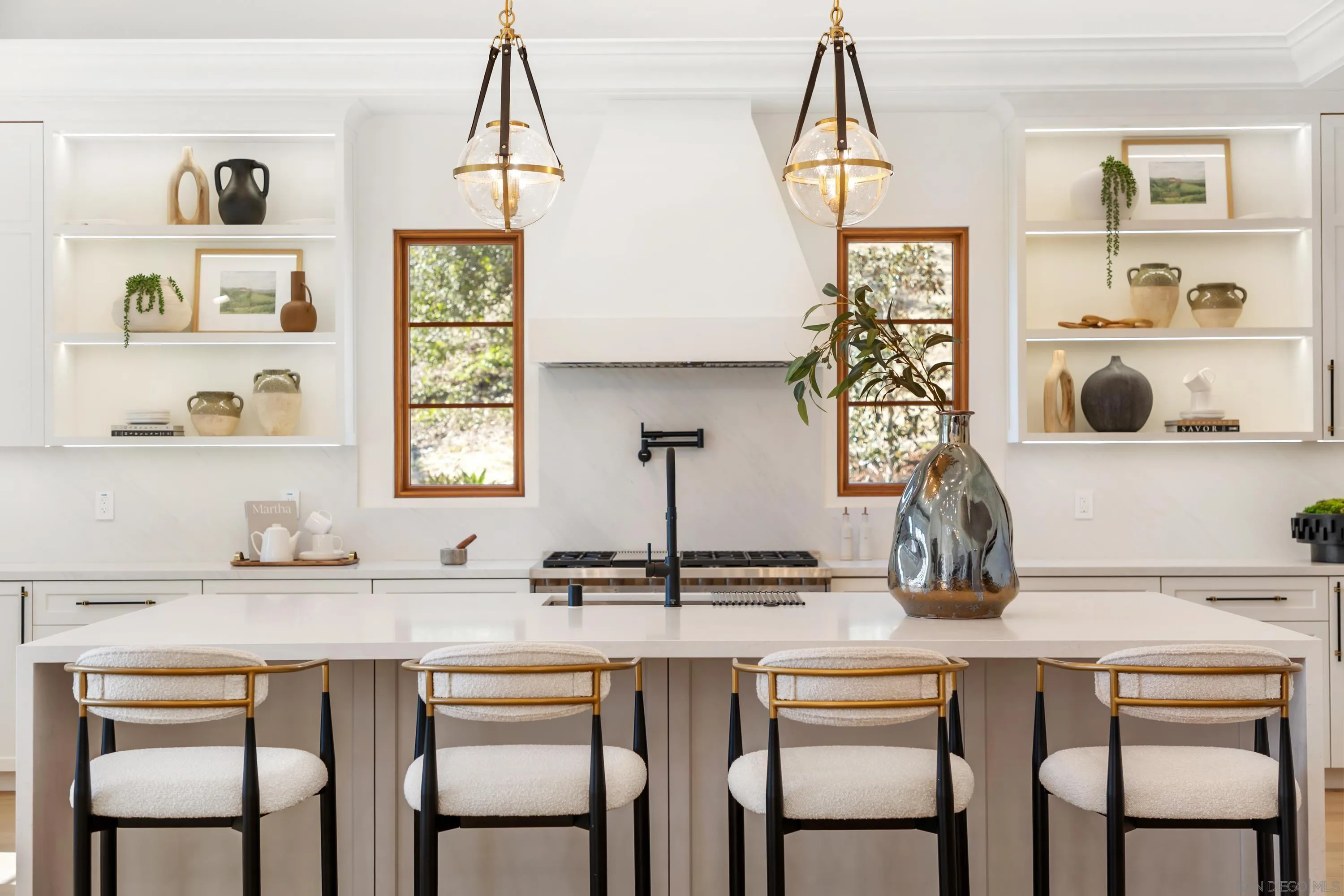 5758-60 Las Palomas Rancho Santa Fe, CA 92067 - Photo 22 of 64 a dining room with two chairs and a table