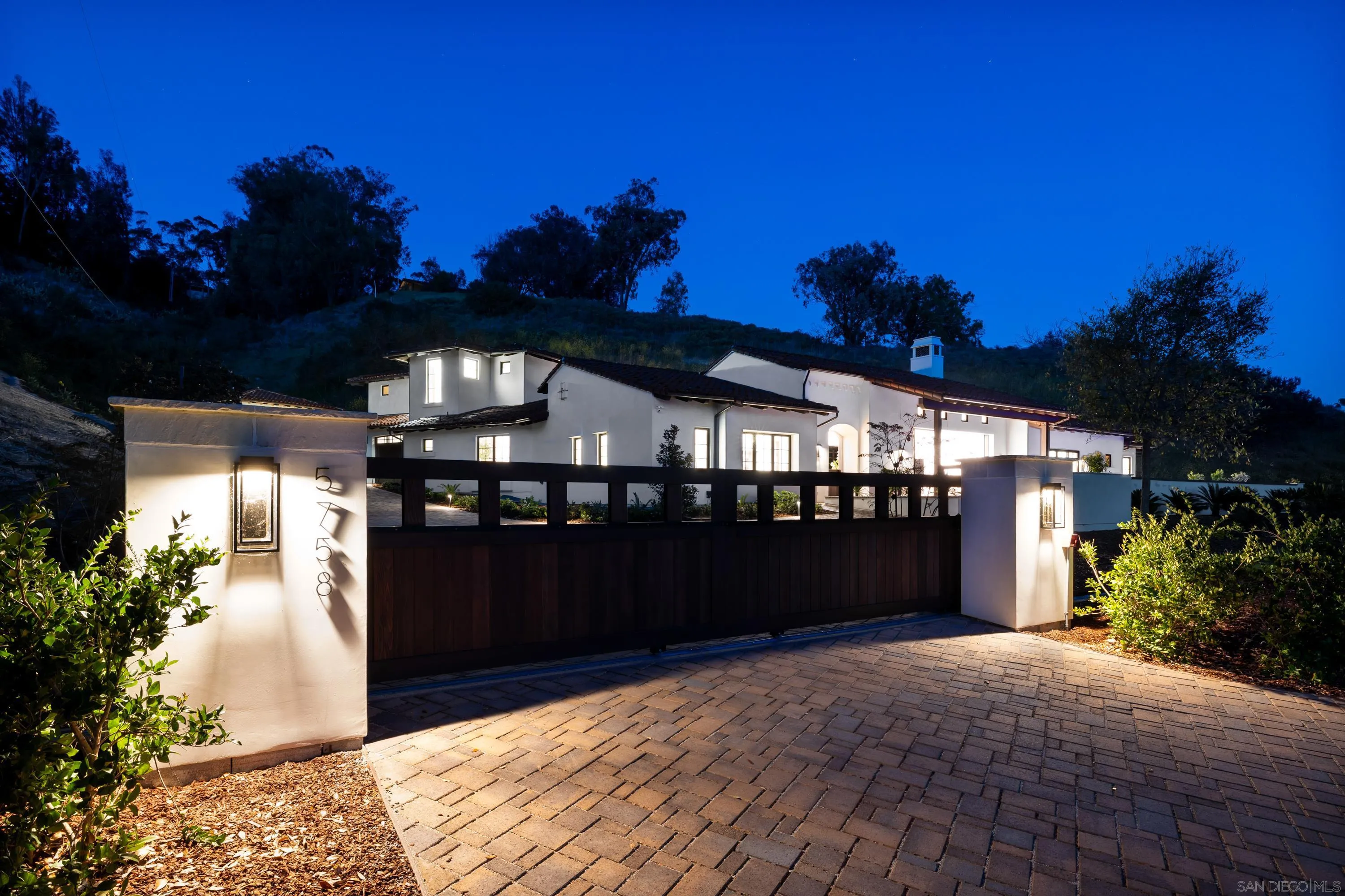 5758-60 Las Palomas Rancho Santa Fe, CA 92067 - Photo 25 of 64 a front view of a house with a yard