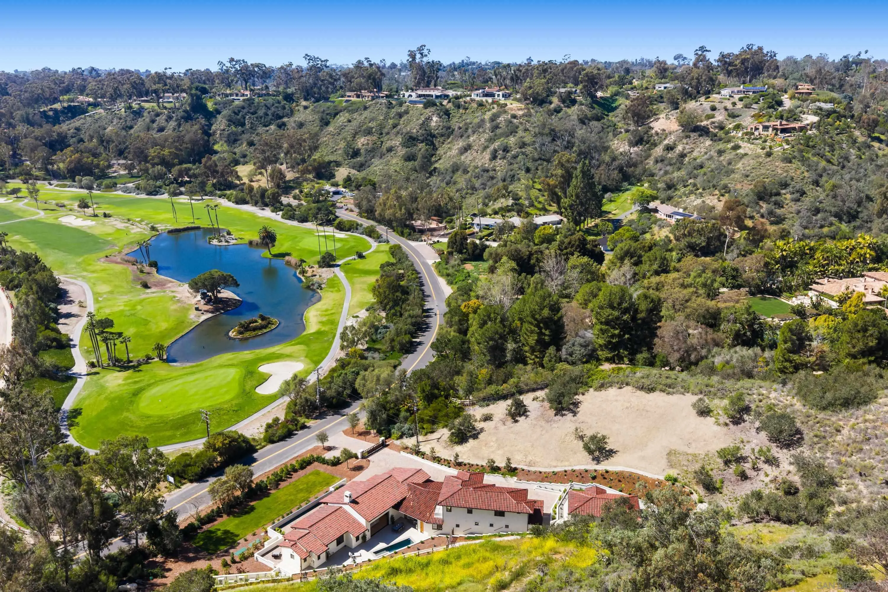 5758-60 Las Palomas Rancho Santa Fe, CA 92067 - Photo 32 of 64 an aerial view of swimming pool yard and mountain view in back