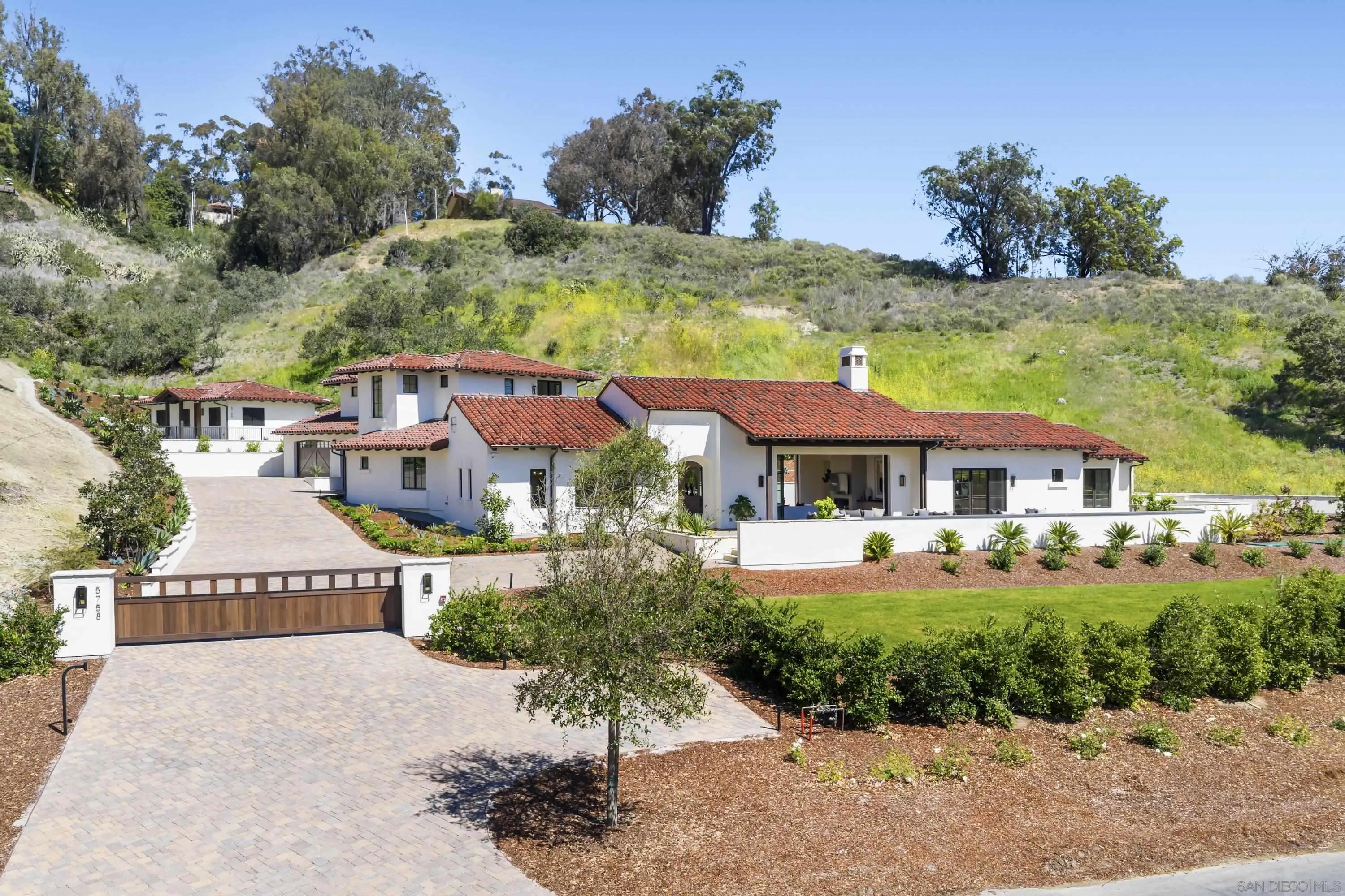 5758-60 Las Palomas Rancho Santa Fe, CA 92067 - Photo 34 of 64 a view of a house with garden and a sitting area