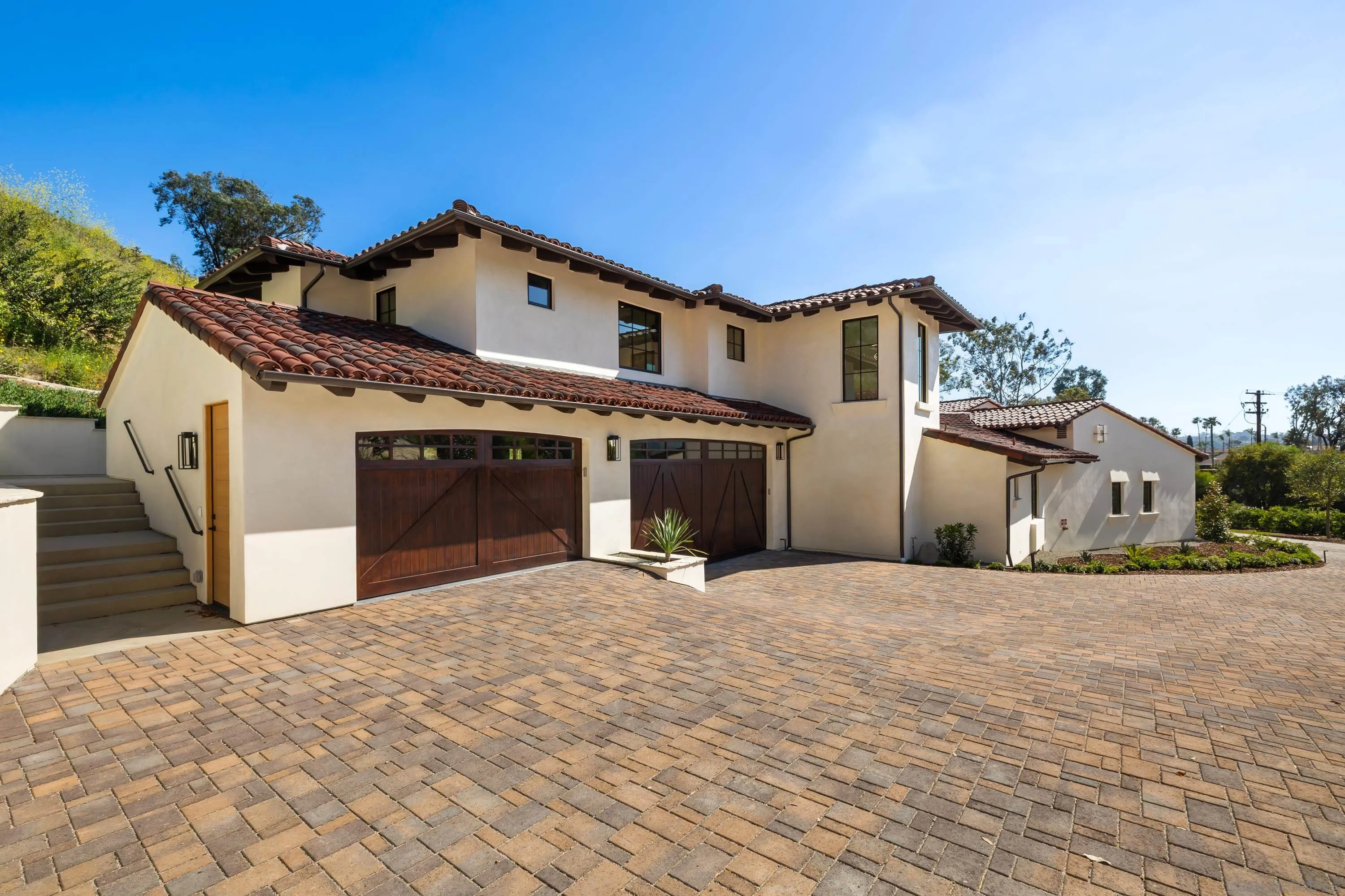 5758-60 Las Palomas Rancho Santa Fe, CA 92067 - Photo 37 of 64 a front view of a house with a garage