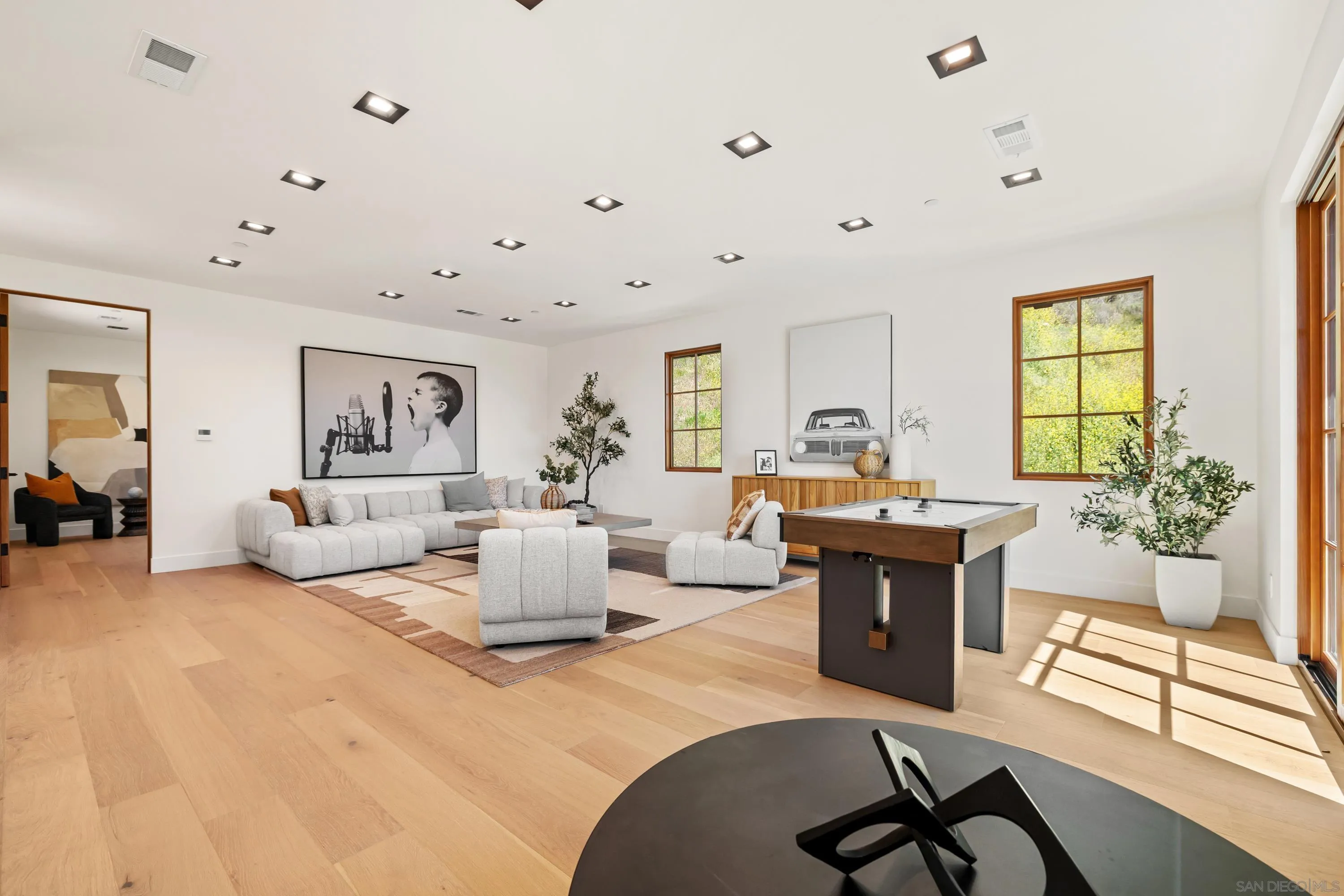 5758-60 Las Palomas Rancho Santa Fe, CA 92067 - Photo 40 of 64 a living room with furniture and wooden floor