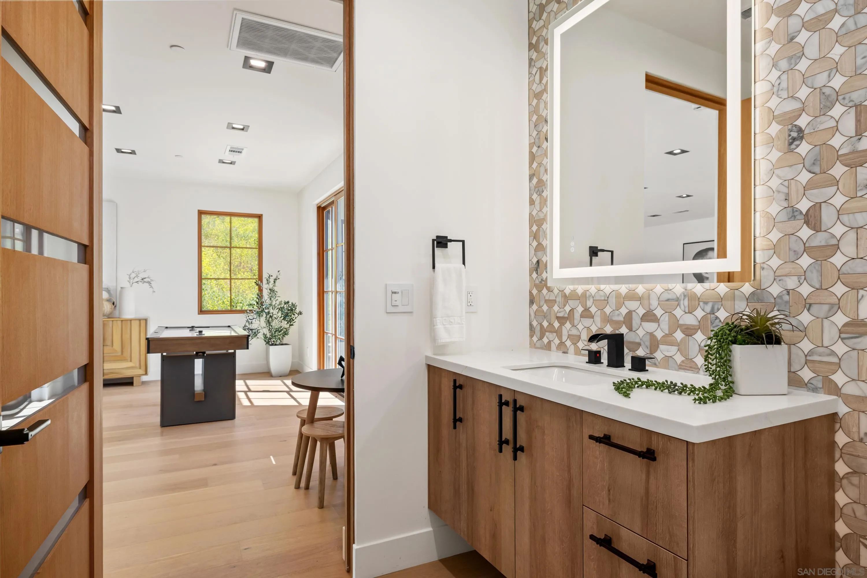 5758-60 Las Palomas Rancho Santa Fe, CA 92067 - Photo 42 of 64 a bathroom with a sink vanity granite tub and a mirror