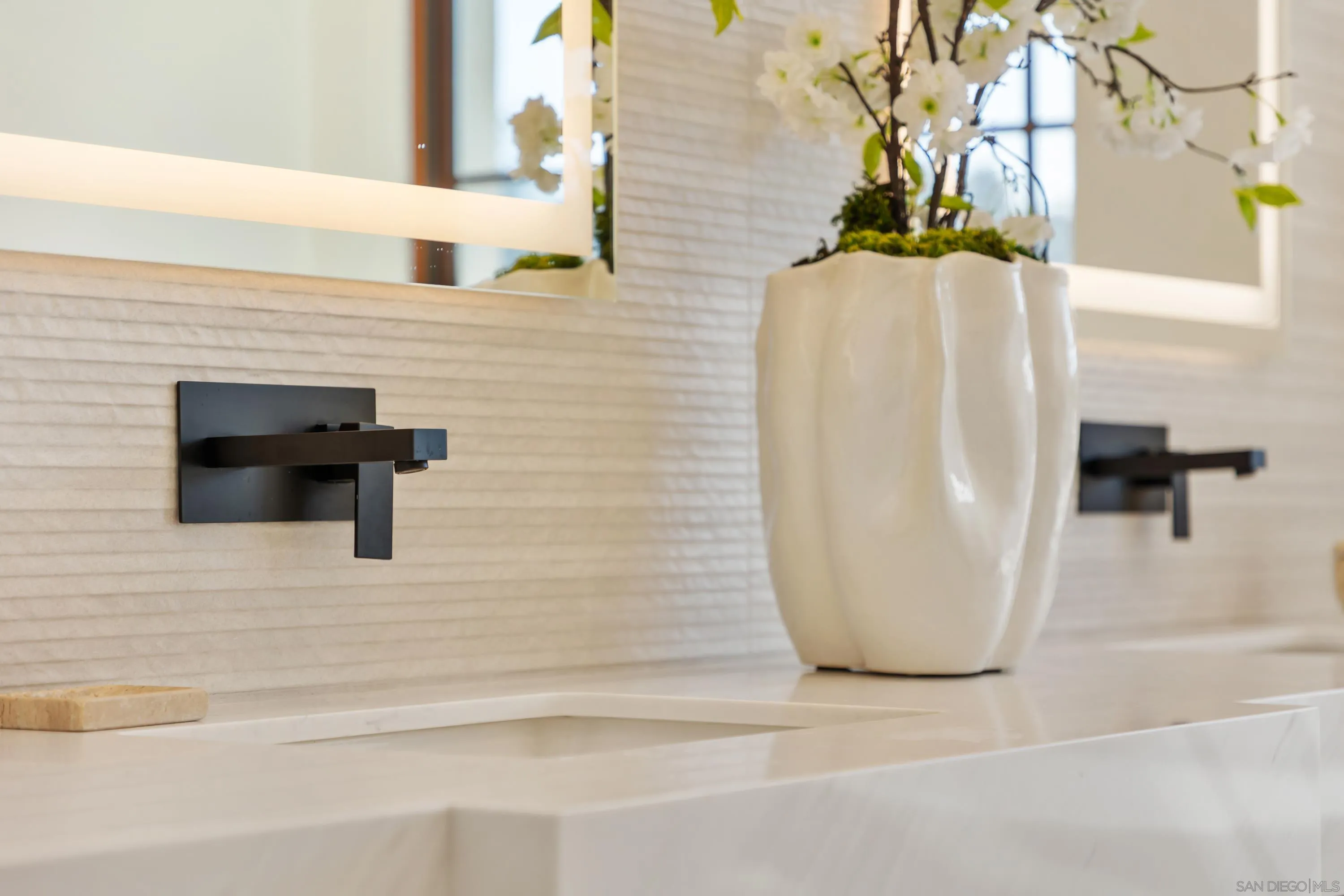 5758-60 Las Palomas Rancho Santa Fe, CA 92067 - Photo 46 of 64 a bathroom with a sink and a mirror
