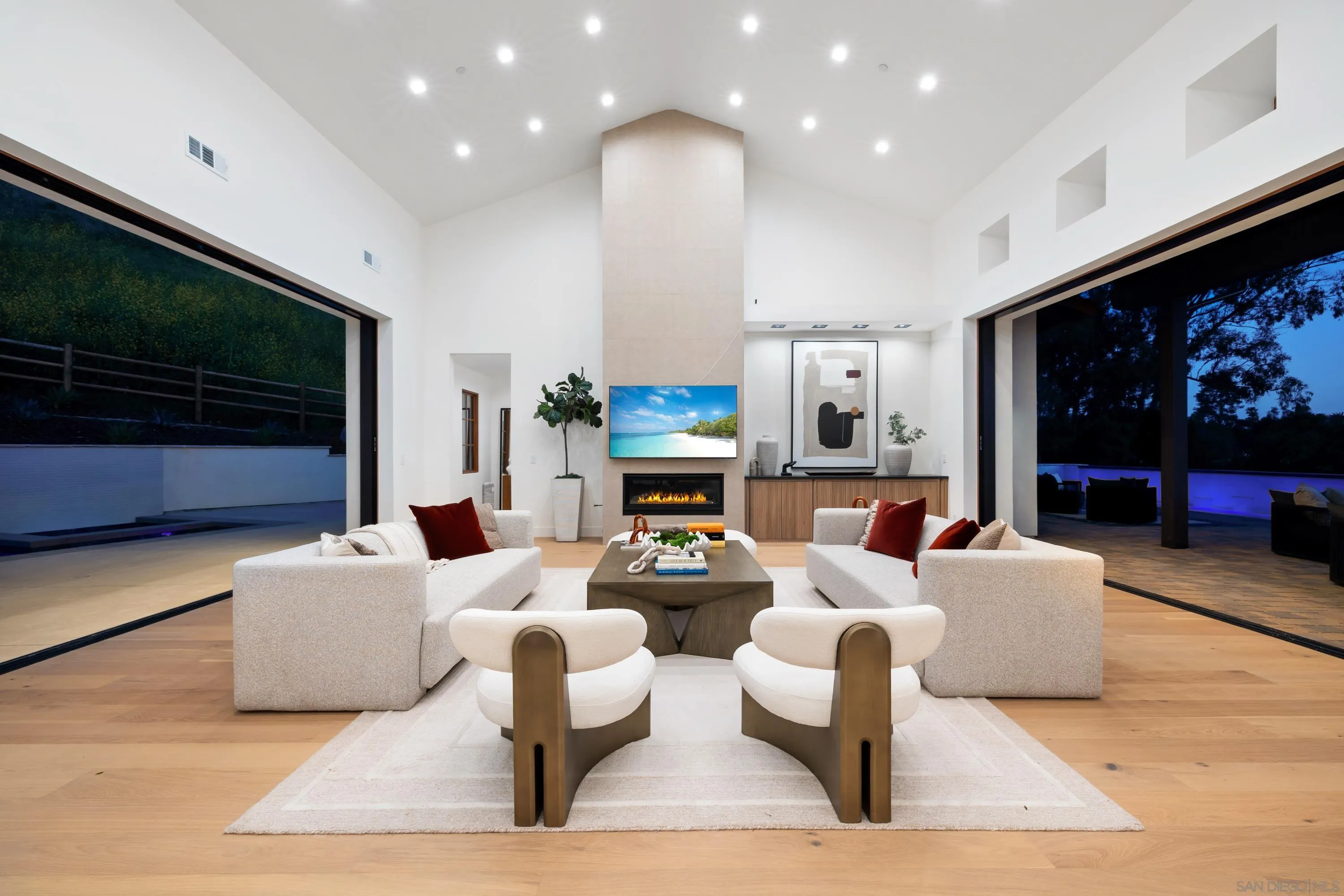 5758-60 Las Palomas Rancho Santa Fe, CA 92067 - Photo 6 of 64 a living room with fireplace furniture and a flat screen tv