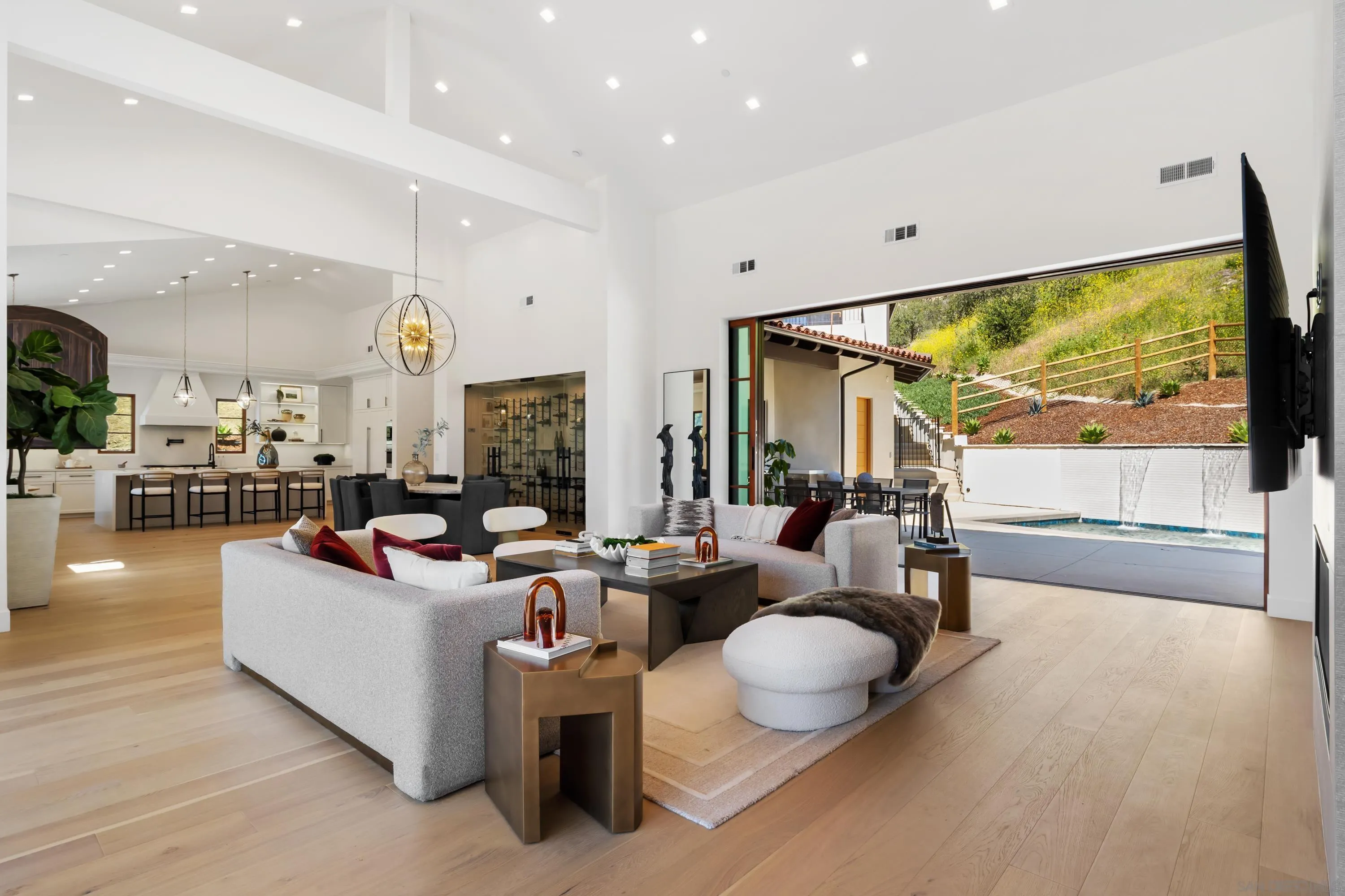 5758-60 Las Palomas Rancho Santa Fe, CA 92067 - Photo 7 of 64 a living room with fireplace furniture and a large window