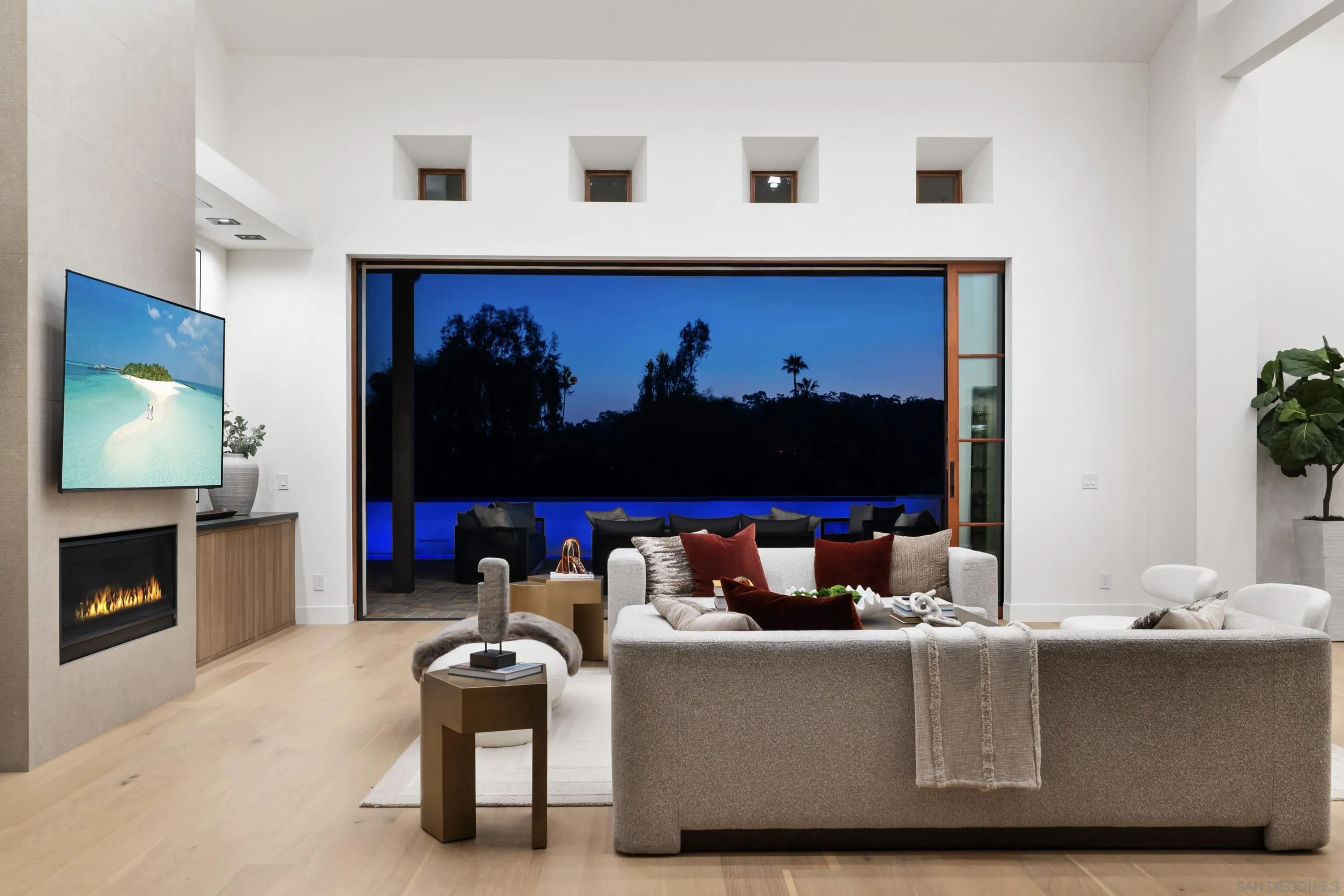 5758-60 Las Palomas Rancho Santa Fe, CA 92067 - Photo 8 of 64 a living room with furniture and a fireplace