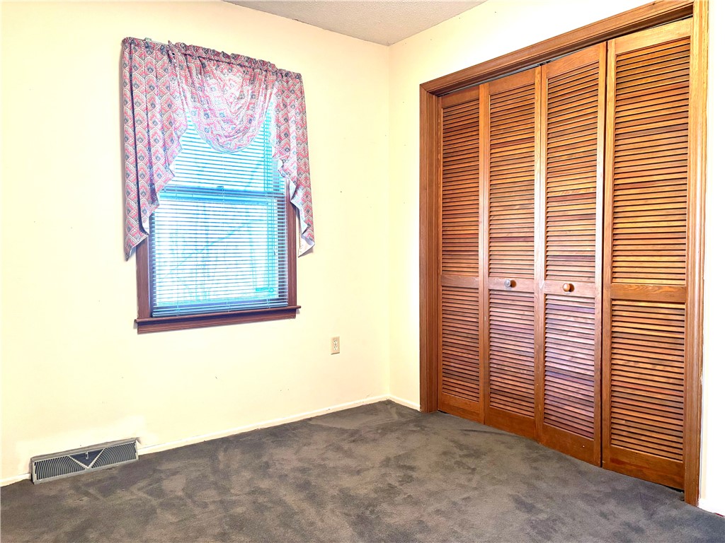 112 Ross Drive Starr, SC 29684 - Photo 12 of 23 This cozy bedroom features a practical closet and a window that invites natural light.