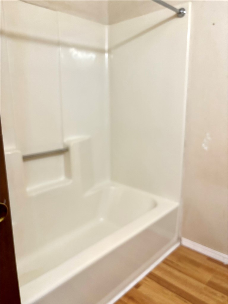 112 Ross Drive Starr, SC 29684 - Photo 8 of 23 This bathroom features a sleek, integrated bathtub and shower combination.