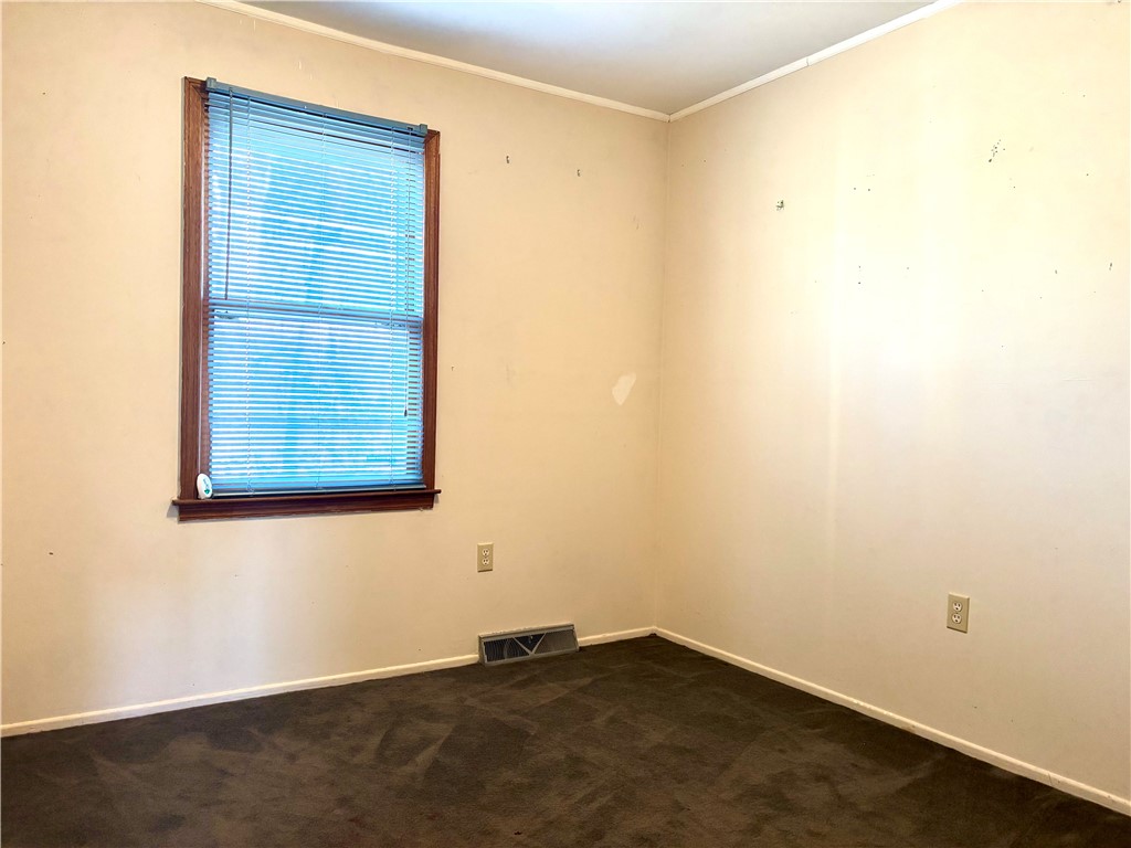 112 Ross Drive Starr, SC 29684 - Photo 9 of 23 This cozy bedroom features a single window, offering ample natural light.