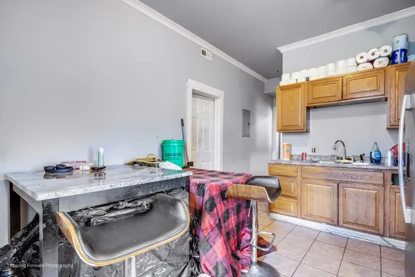 a bathroom with a sink a stove a washer and dryer