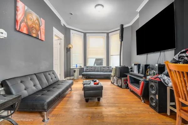 a living room with furniture and a flat screen tv