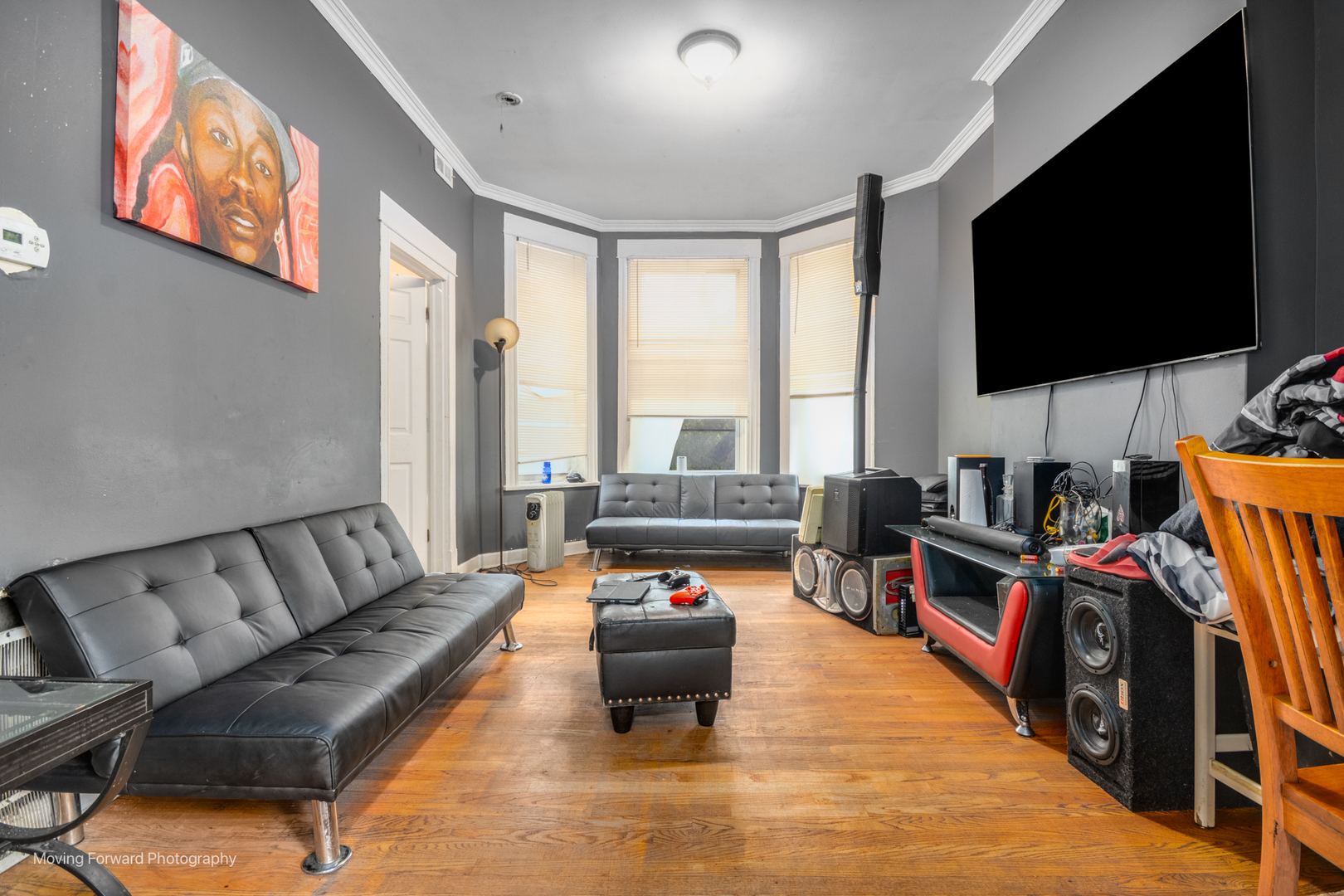 817 West 54th Street Chicago, IL 60609 - Photo 5 of 29 a living room with furniture and a flat screen tv