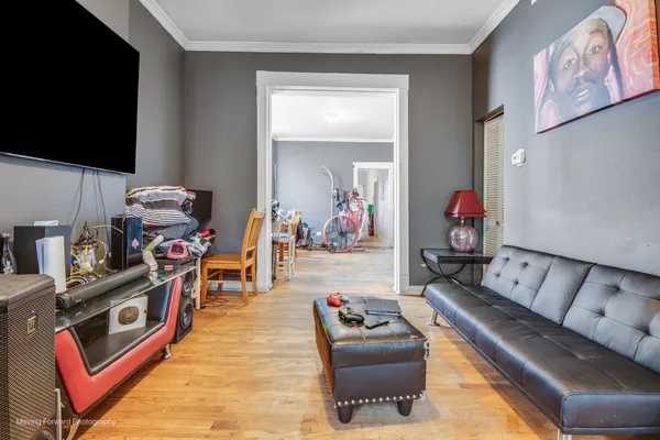 a living room with furniture and a flat screen tv