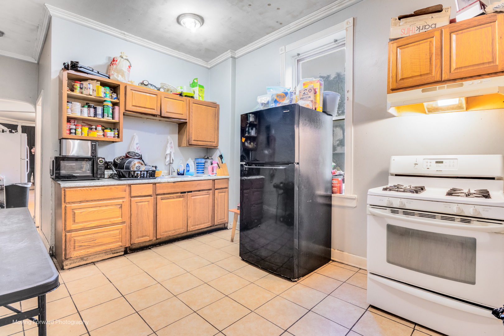 817 West 54th Street Chicago, IL 60609 - Photo 9 of 29 a kitchen with stainless steel appliances granite countertop a refrigerator and a stove