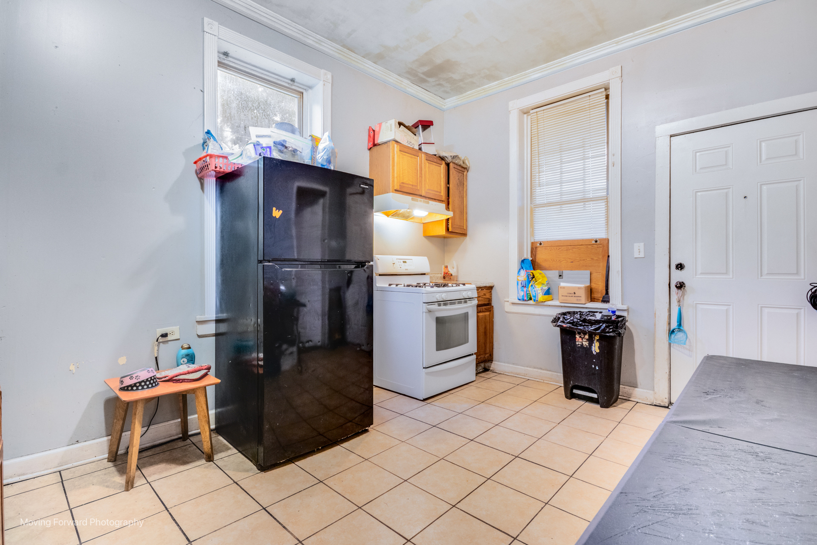 817 West 54th Street Chicago, IL 60609 - Photo 10 of 29 a kitchen with stainless steel appliances granite countertop a refrigerator sink and stove