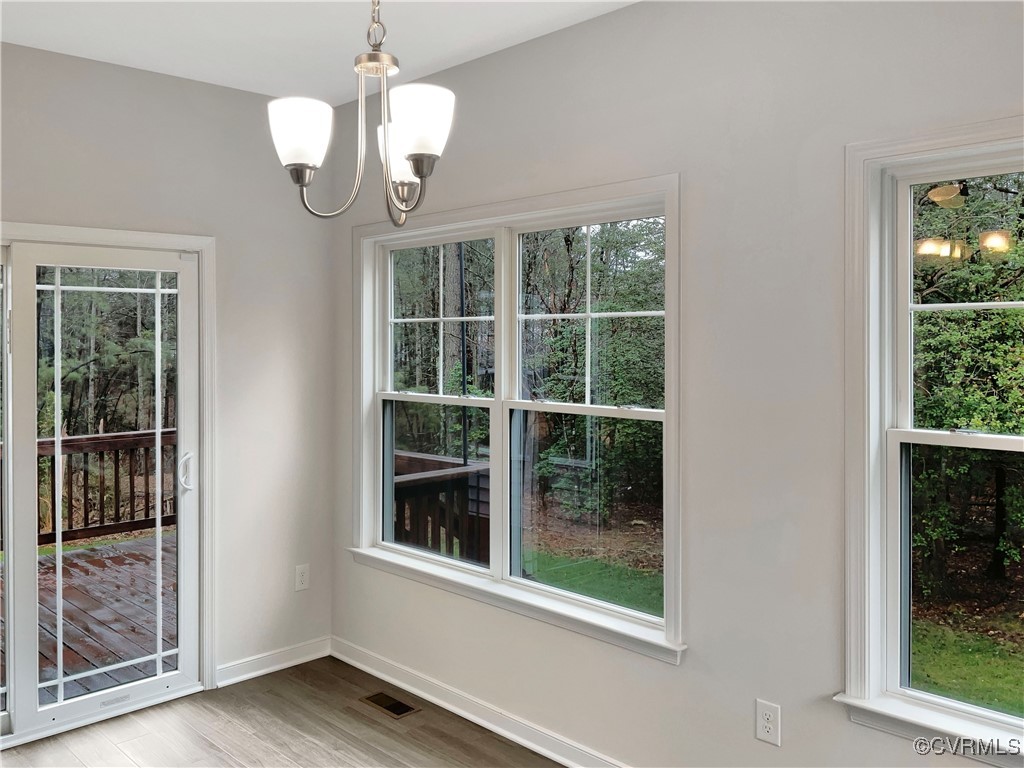 2206 White Oak Circle Aylett, VA 23009 - Photo 16 of 25 a view of a room with wooden floor and windows