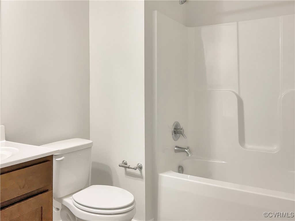 2206 White Oak Circle Aylett, VA 23009 - Photo 19 of 25 a white toilet sitting next to a bath tub