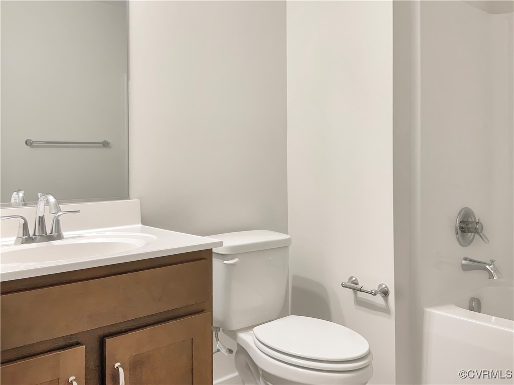 2206 White Oak Circle Aylett, VA 23009 - Photo 20 of 25 a bathroom with a sink a toilet and vanity