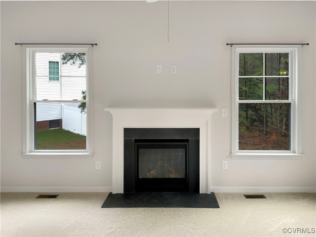 2206 White Oak Circle Aylett, VA 23009 - Photo 3 of 25 an empty room with furniture and a fireplace