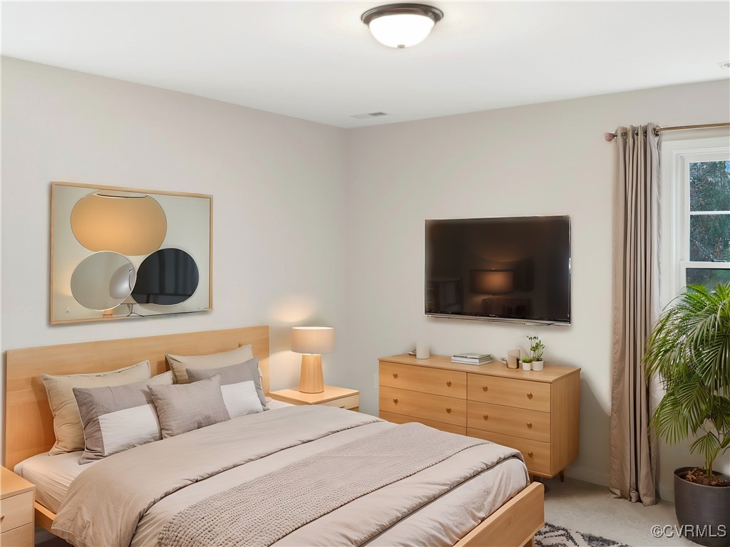 2206 White Oak Circle Aylett, VA 23009 - Photo 4 of 25 a bedroom with a bed and a flat screen tv