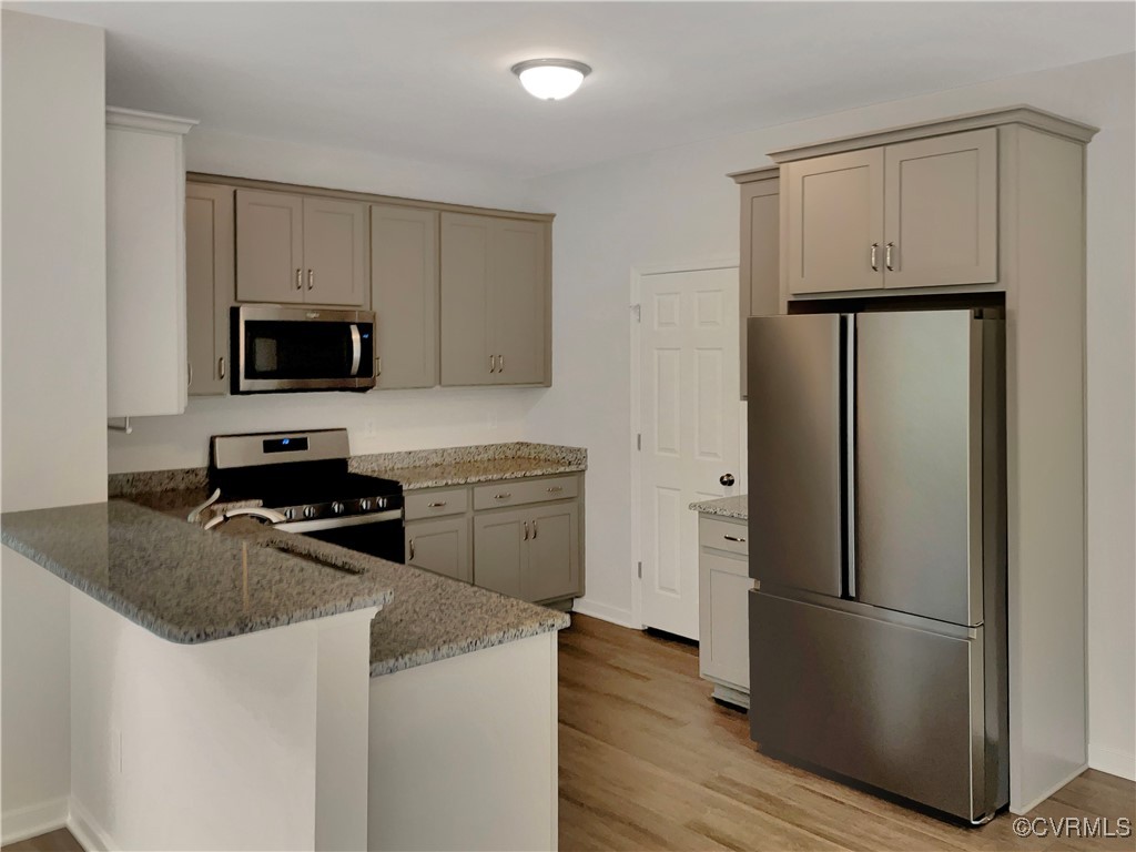 2206 White Oak Circle Aylett, VA 23009 - Photo 6 of 25 a kitchen with a refrigerator stove and microwave