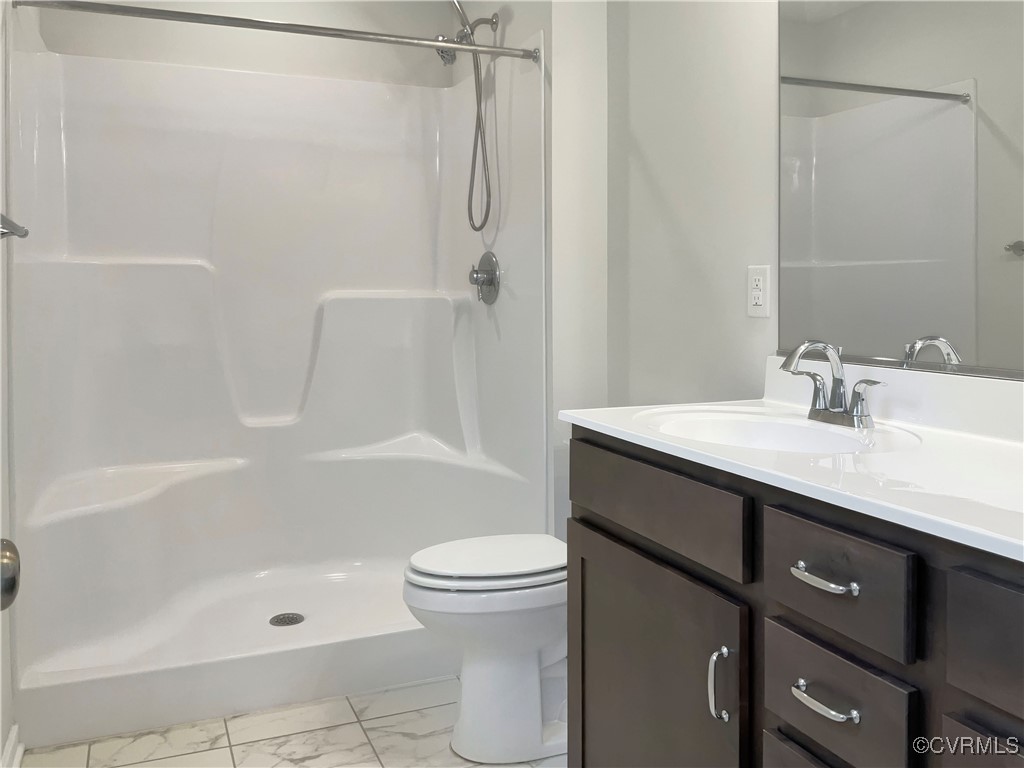 2206 White Oak Circle Aylett, VA 23009 - Photo 7 of 25 a bathroom with a sink a toilet and shower