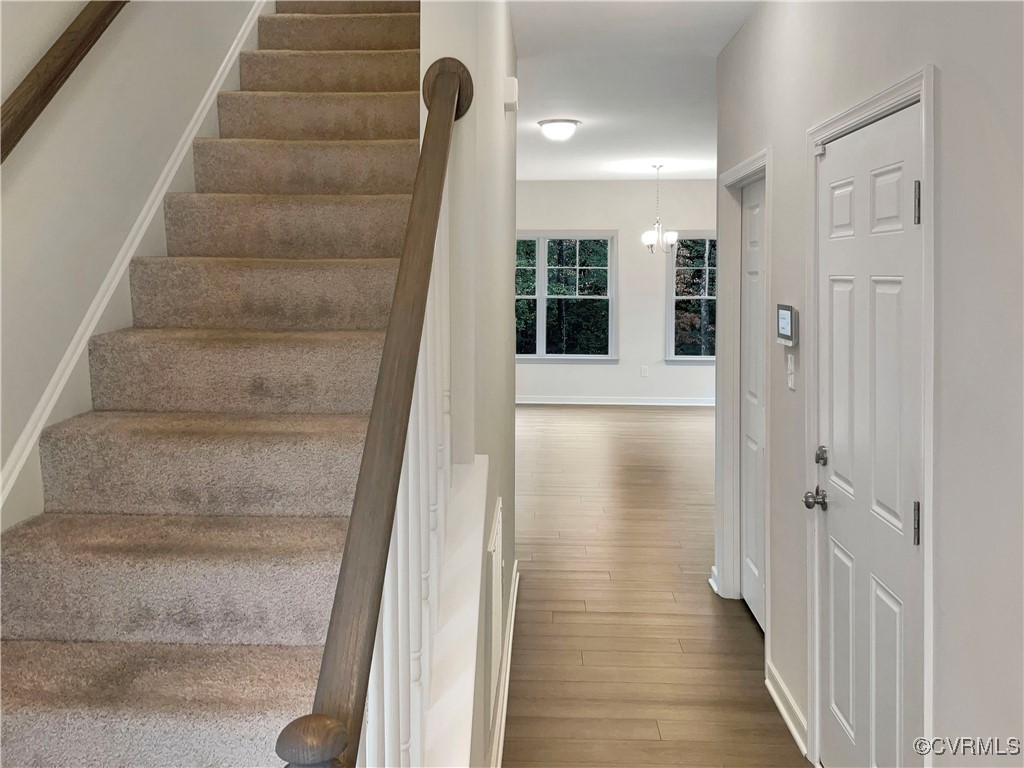 2206 White Oak Circle Aylett, VA 23009 - Photo 10 of 25 a view of a hallway with wooden floor and entryway