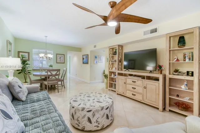 a view of a livingroom with workspace and a couch