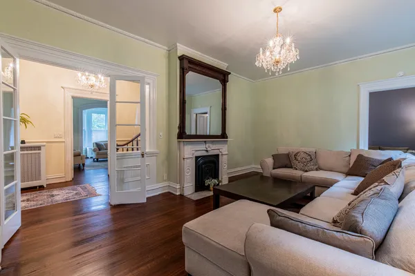 a living room with furniture flat screen tv and a fireplace