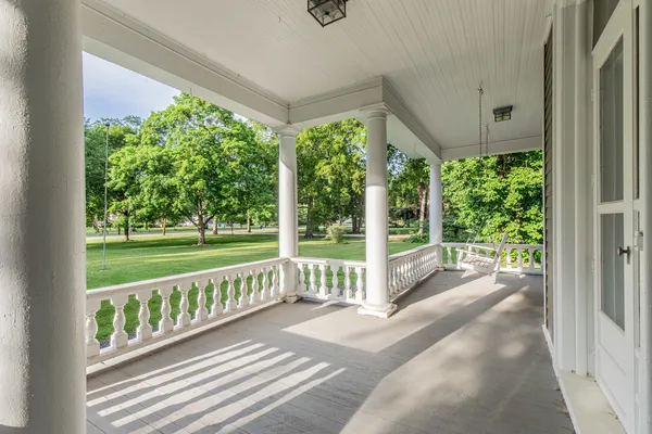 a view of a two chair in the porch