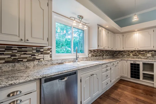 a kitchen with a stove a sink and a refrigerator