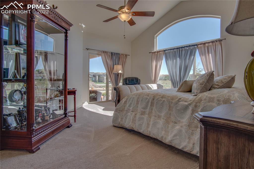 113 Rocchio Drive Florence, CO 81226 - Photo 18 of 34 a bedroom with a bed and a chandelier