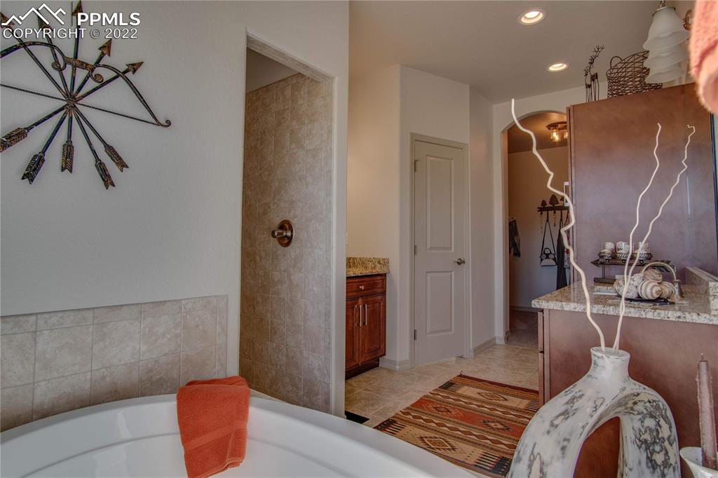 113 Rocchio Drive Florence, CO 81226 - Photo 25 of 34 a bedroom with a bed and a rug