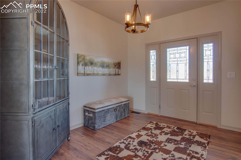 113 Rocchio Drive Florence, CO 81226 - Photo 5 of 34 a room with gym equipment and a rug