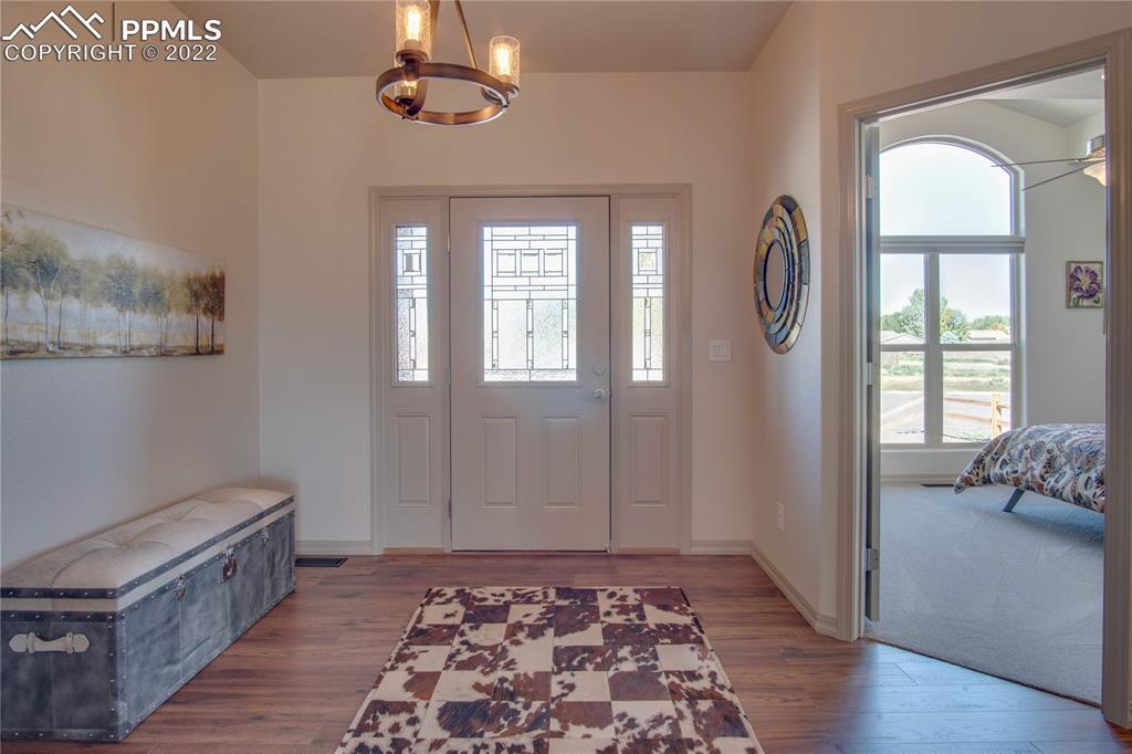 113 Rocchio Drive Florence, CO 81226 - Photo 6 of 34 a view of room with window and wooden floor