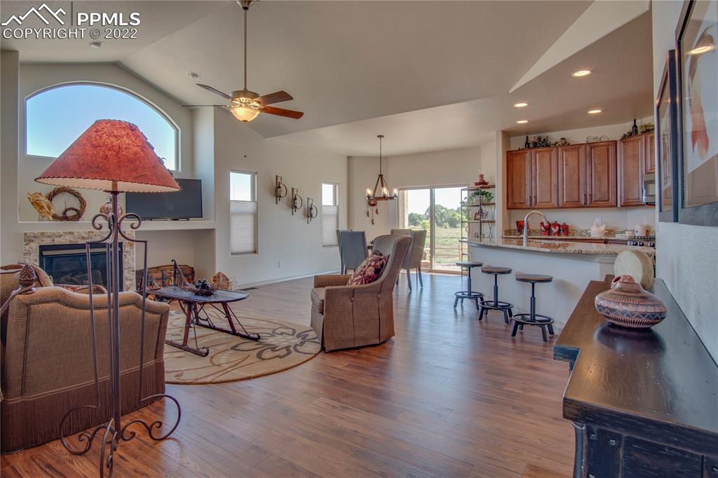113 Rocchio Drive Florence, CO 81226 - Photo 7 of 34 a living room with fireplace furniture and a wooden floor