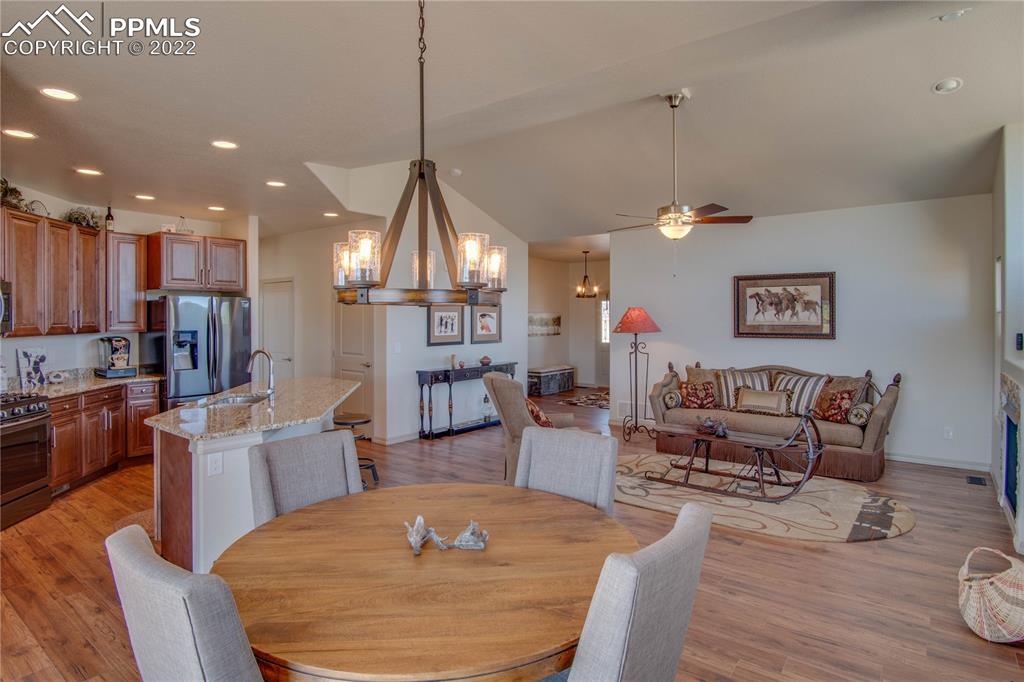 113 Rocchio Drive Florence, CO 81226 - Photo 9 of 34 a living room with furniture a dining table and kitchen view