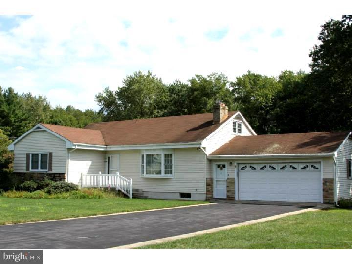 8 Tindall Road Robbinsville, NJ 08691 - Photo 1 of 21 a front view of a house with a garden and plants