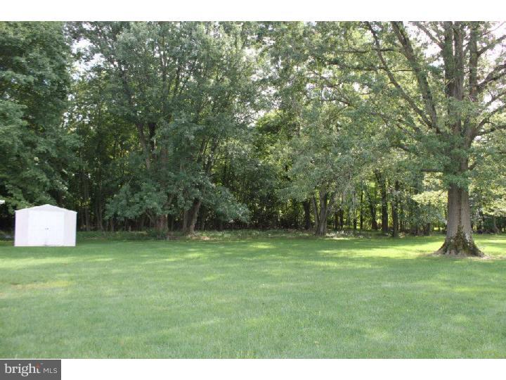 8 Tindall Road Robbinsville, NJ 08691 - Photo 4 of 21 a backyard of a house with trees