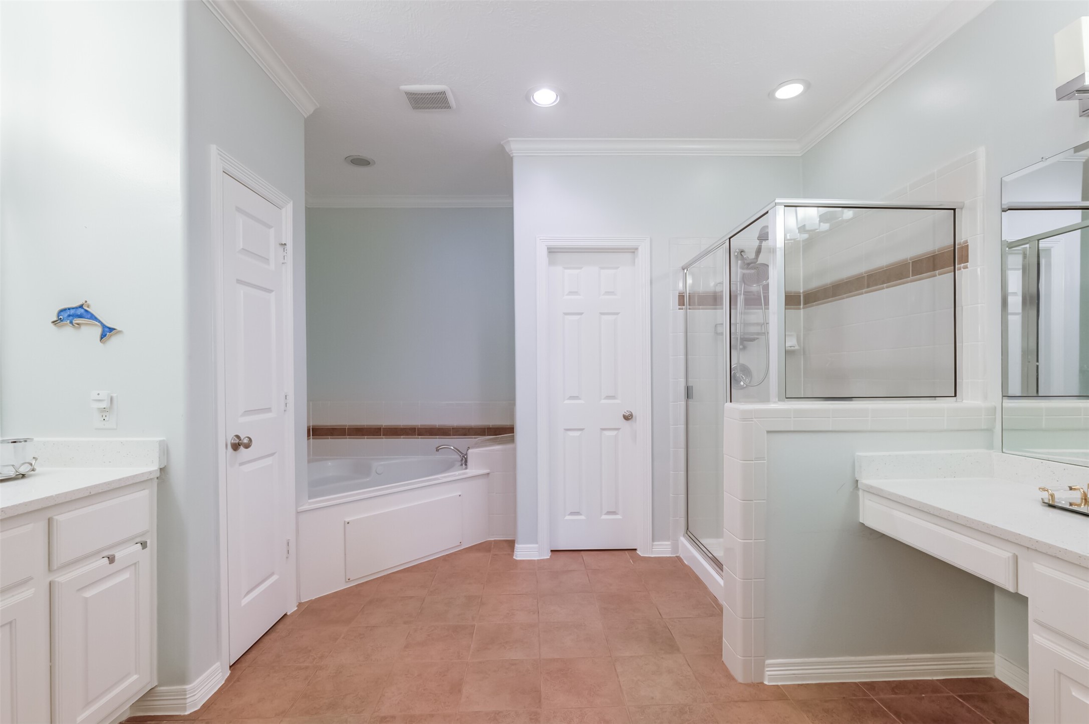 7515 Shady Villa Walk Houston, TX 77055 - Photo 12 of 23 Primary bath with dual vanities with quartz counters, storage and vanity lights, vanity knee space, separate jetted tub, large walk-in shower, linen/storage closet, plus separate water closet.