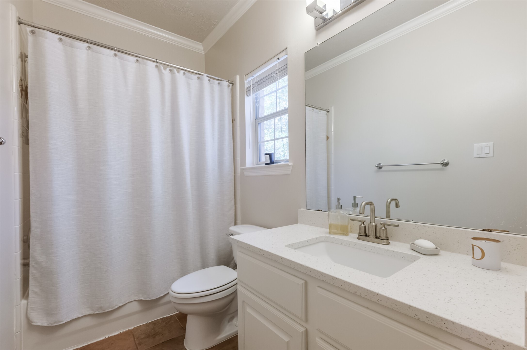 7515 Shady Villa Walk Houston, TX 77055 - Photo 15 of 23 Guest bath is conveniently on the second floor next to the guest bedrooms. Features a quartz countertop, tub/shower combination, linen closet and good storage. Utility room (not pictured) is conveniently located on the second floor with all of the bedrooms. Washer and dryer are included. Utility closet has a dry bar and storage cabinets. Next to the utility closet is a linen closet.