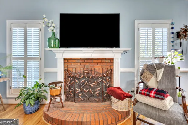 a living room with furniture and flat screen tv