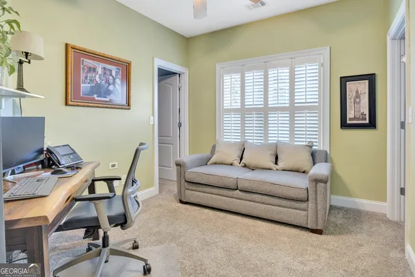 a bedroom with a bed and a book shelf