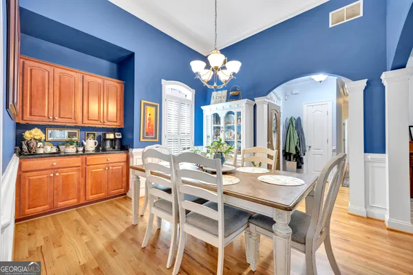 a view of a dining room with furniture window and wooden floor